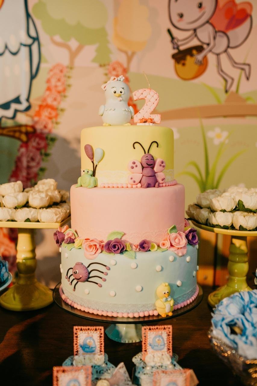 Festive cake for children in honor of birthday celebration placed on banquet table